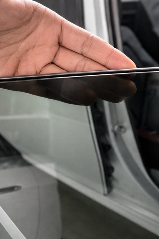 Professional micro-edge window tint installation Calgary - factory flush shaved edge zero gap precision workmanship